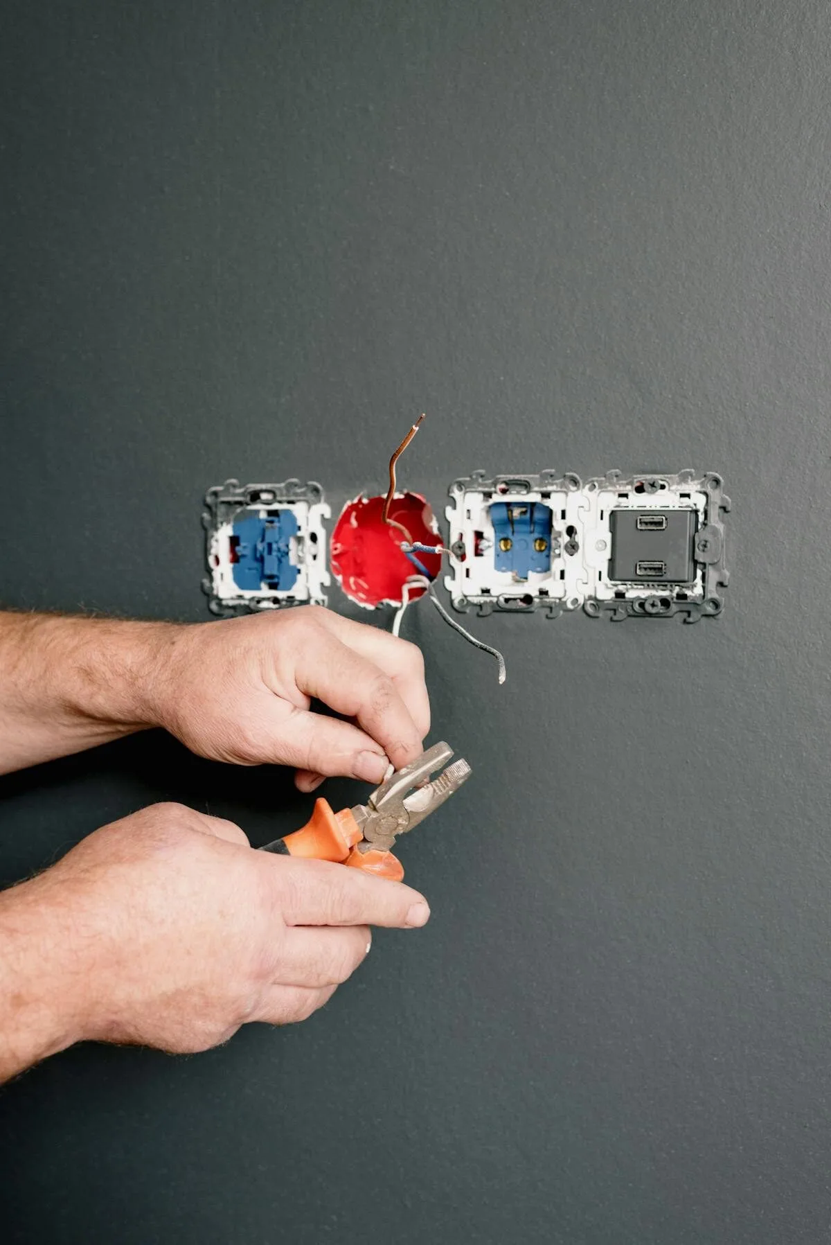 Professional electrician working on electrical panel — Superior Electrical
